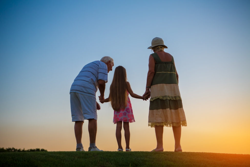 Girl and her grandparents.