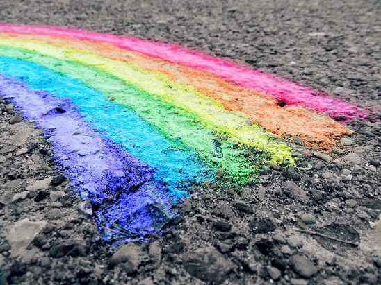 Pride flag chalk drawn on the floor