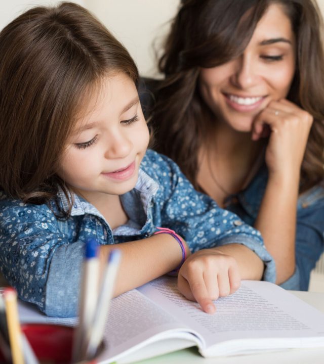 mother-helping-child-with-homework-2021-09-02-10-31-10-utc